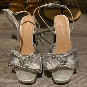 Silver bow heels